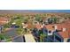 Aerial view of a residential community featuring red tiled roofs, trees, and landscaping at 3830 E Lakewood E Pkwy # 2009, Phoenix, AZ 85048