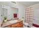 This bathroom features a bathtub with shower curtain and a single sink vanity at 3830 E Lakewood E Pkwy # 2009, Phoenix, AZ 85048