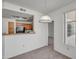 Dining room with a pendant light fixture and view of the kitchen at 3830 E Lakewood E Pkwy # 2009, Phoenix, AZ 85048