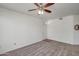 A simple empty living room featuring neutral carpet and a white wall at 3830 E Lakewood E Pkwy # 2009, Phoenix, AZ 85048