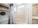 Bright bathroom features a walk-in shower with grab bars, toilet, and storage shelf at 384 Gypsum Dr, Apache Junction, AZ 85119