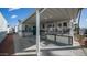 Exterior view of a mobile home with a covered carport and porch, offering convenient parking and outdoor enjoyment at 384 Gypsum Dr, Apache Junction, AZ 85119