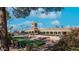 Golden Vista resort community with landscaping, a putting green, and parking at 384 Gypsum Dr, Apache Junction, AZ 85119