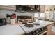 Open kitchen features a black electric stove and oven, white countertops, and view into the living room at 384 Gypsum Dr, Apache Junction, AZ 85119