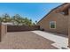 A large, open backyard with gravel, perfect for outdoor activities and low-maintenance landscaping at 4187 N 183Rd Dr, Goodyear, AZ 85395