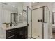 Contemporary bathroom featuring a sleek vanity, glass-enclosed shower, and modern fixtures at 4187 N 183Rd Dr, Goodyear, AZ 85395