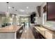 Spacious kitchen featuring a center island, granite countertops, and stainless steel appliances at 4187 N 183Rd Dr, Goodyear, AZ 85395