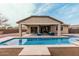 Inviting pool and covered patio perfect for outdoor entertaining and relaxation on sunny days at 4187 N 183Rd Dr, Goodyear, AZ 85395