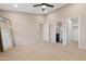 Neutral bedroom with plush carpeting and ensuite bathroom access at 44321 Cypress Ln, Maricopa, AZ 85138