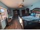 Spacious bedroom with seating area and dark wood furniture at 45020 N 18Th St, New River, AZ 85087