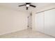 Comfortable bedroom featuring modern tile flooring and a closet with sliding doors at 4720 N 63Rd Ave, Phoenix, AZ 85033