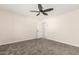 The bedroom is a serene space with soft carpet and a ceiling fan at 4720 N 63Rd Ave, Phoenix, AZ 85033