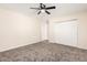 Spacious bedroom with carpet flooring and a closet with sliding doors, ideal for storage solutions at 4720 N 63Rd Ave, Phoenix, AZ 85033