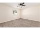 Inviting bedroom with soft carpet flooring and a large window, creating a relaxing atmosphere at 4720 N 63Rd Ave, Phoenix, AZ 85033