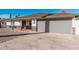 Charming home with a desert rock yard, stone accents, two car garage, and well-maintained driveway at 4720 N 63Rd Ave, Phoenix, AZ 85033