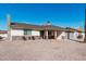 Charming home with desert rock, stone accents, covered entry and a well-manicured lawn at 4720 N 63Rd Ave, Phoenix, AZ 85033