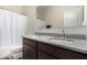 Bathroom with a double sink vanity, granite countertops, and a large mirror at 5180 E Diatomite Dr, San Tan Valley, AZ 85143