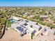 Stunning aerial shot of a sprawling property with a pool, solar panels, and beautifully landscaped grounds at 5237 E Montgomery Rd, Cave Creek, AZ 85331