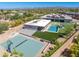 Aerial view of home with sport court, pool, and covered patio nestled in desert landscape at 5237 E Montgomery Rd, Cave Creek, AZ 85331