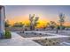 Desert landscaping in backyard at dusk featuring pavers, gravel, cacti and desert trees at 5237 E Montgomery Rd, Cave Creek, AZ 85331