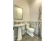 Elegant powder room features a pedestal sink, marble accents, and stylish decor at 5237 E Montgomery Rd, Cave Creek, AZ 85331