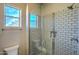 Bright bathroom with a tiled shower, glass door, and window for natural light at 5237 E Montgomery Rd, Cave Creek, AZ 85331