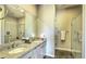 Bathroom featuring double sinks, granite counters, and a walk-in shower with white subway tile at 5237 E Montgomery Rd, Cave Creek, AZ 85331