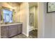 Modern bathroom featuring granite countertops, gray cabinetry, and a tiled shower-tub combination at 5237 E Montgomery Rd, Cave Creek, AZ 85331