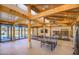 Bonus room with wood beams, a ping pong table, and sliding glass doors leading to the pool at 5237 E Montgomery E Rd, Cave Creek, AZ 85331