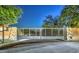 Night shot of neighborhood entrance gate featuring steel and stone pillars at 5237 E Montgomery E Rd, Cave Creek, AZ 85331