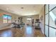 Spacious home gym features modern equipment, hardwood floors, and ample natural light from multiple windows at 5237 E Montgomery E Rd, Cave Creek, AZ 85331