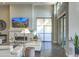 Bright and airy living room showcasing stylish seating, a fireplace, and a seamless transition to the outdoors at 5237 E Montgomery E Rd, Cave Creek, AZ 85331