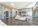 Open-concept living room featuring a fireplace, stylish sofas, and large windows for natural light at 5237 E Montgomery E Rd, Cave Creek, AZ 85331