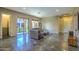 Bright living room features tile floors, neutral tones, and a view of the outdoor patio through sliding glass doors at 5237 E Montgomery Rd, Cave Creek, AZ 85331