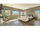 Bright main bedroom with wood floors, large windows, and a comfortable seating area with neutral tones at 5237 E Montgomery E Rd, Cave Creek, AZ 85331