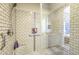 Walk-in shower featuring white subway tile, a built-in niche, and bench seating at 5237 E Montgomery Rd, Cave Creek, AZ 85331