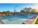 Outdoor sport court area for tennis or basketball with gravel border, block wall and desert plants at 5237 E Montgomery Rd, Cave Creek, AZ 85331