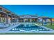 Backyard view showcasing the rectangular pool, artificial grass, and the home's exterior design at 5237 E Montgomery E Rd, Cave Creek, AZ 85331