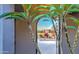 Looking through a home archway at the colorful desert landscaping and houses beyond at 5237 E Montgomery Rd, Cave Creek, AZ 85331