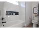 Stylish bathroom with a bathtub and shower combo, featuring white marble tile at 54Xx E El Sendero Dr, Cave Creek, AZ 85331