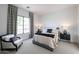 Bedroom featuring a large window with patterned curtains and a comfortable chair at 54Xx E El Sendero Dr, Cave Creek, AZ 85331