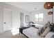 Bright modern bedroom featuring twin beds, contemporary lighting, and views of outdoors at 54Xx E El Sendero Dr, Cave Creek, AZ 85331