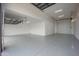 Large, well-lit garage with an epoxy floor, offering ample space for vehicles and storage solutions at 54Xx E El Sendero Dr, Cave Creek, AZ 85331