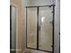 Walk-in shower with glass doors and convenient grab bar at 6001 E Southern Ave # 68, Mesa, AZ 85206