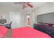 Comfortable bedroom with closet, an adjoining bathroom, and dresser with TV at 6219 W Navajo Dr, Glendale, AZ 85302