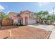 Charming two-story home featuring a well-manicured lawn, desert landscaping, and an attached two-car garage at 6219 W Navajo Dr, Glendale, AZ 85302