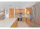 Spacious kitchen featuring a large island, stainless steel appliances, and ample wooden cabinetry for storage at 6219 W Navajo Dr, Glendale, AZ 85302