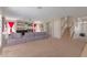 Inviting living area with plush carpeting, fireplace, and staircase leading to the upper level at 6219 W Navajo Dr, Glendale, AZ 85302