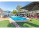 Backyard pool and patio area with a lounge area featuring comfortable seating and a pergola at 6219 W Navajo Dr, Glendale, AZ 85302