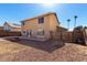 Spacious backyard with a grill, fire pit, and a gate at 8626 W Las Palmaritas Dr, Peoria, AZ 85345